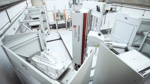 AIM ltd - an image of an Erowa Robot Dynamic working in a factory environment