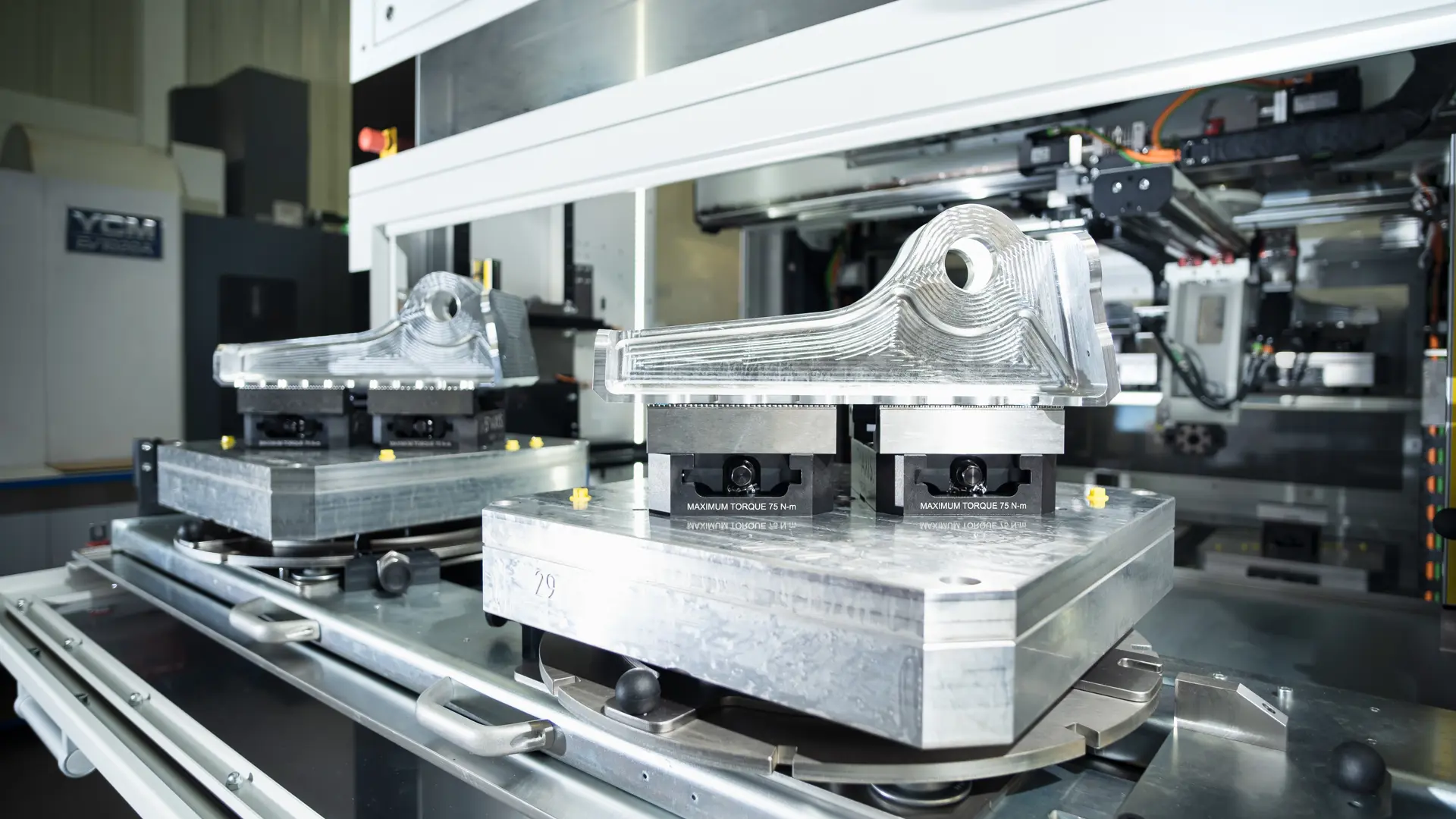 AIM ltd - an image of machine process creating new metal items